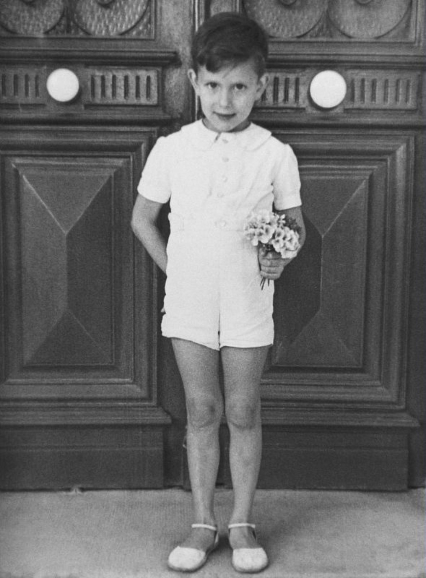 Young YSL holding flowers